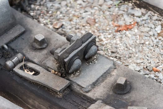 Bolts on a railway in a station in a prak