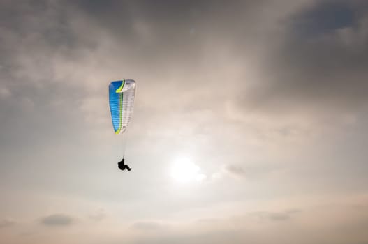 man paragliding from mountain near Rome