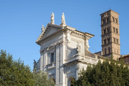 Ruins buildings and statue in the foro romano in Rome italy