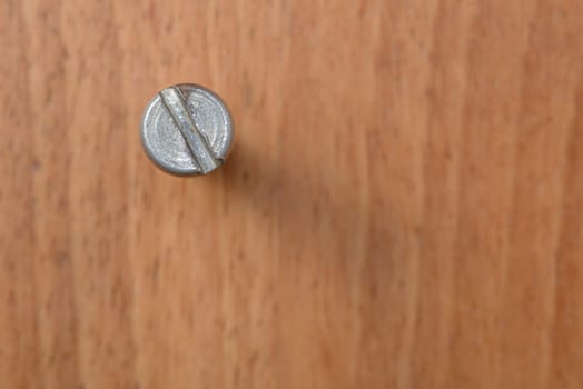 One bolt on wood blur background
