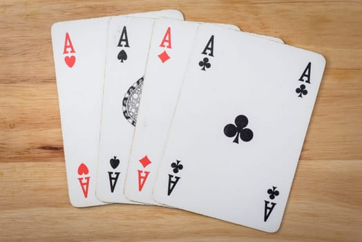 Poker black card on a wood background