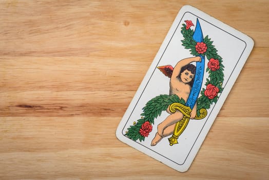 Sword ace italian card on a wood background