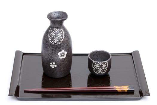 Japanese sake bottle and cup on tray