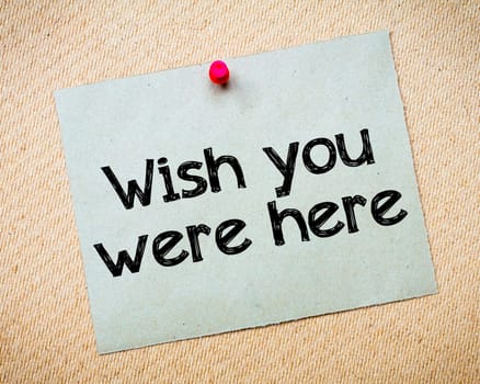 Word of mouth Message. Recycled paper note pinned on cork board. Concept Image