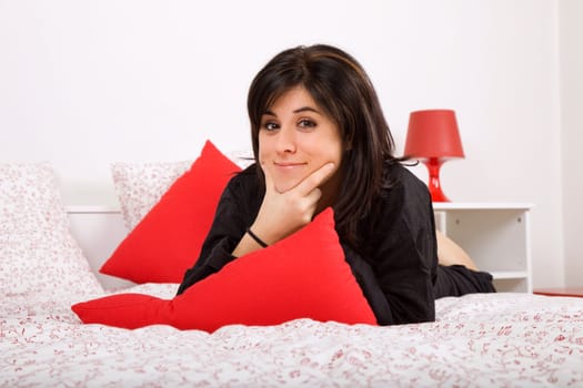 young beautiful sensual woman in bed, studio picture