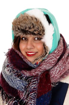 A lovely young woman with a big scarf around her neck and head,.dressed for very cold weather, isolated for white background..