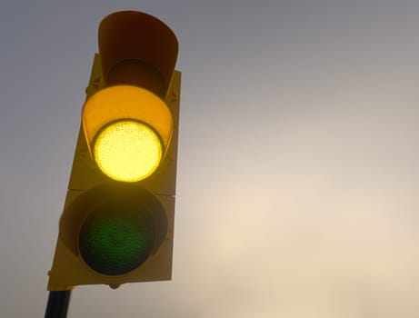 Outdoor vertical traffic light. Traffic control concept image with shallow depth of field.