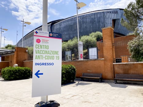 Rome, Italy June 9 2021: Entrance sign for a covid-19 vaccination center in Rome inside the Parco della Musica auditorium. Covid-19 vaccination schedule. Coronavirus pandemic and prevention