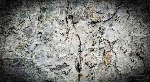 The Dark grey black stone background or texture. Selective focus