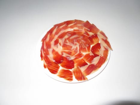 delicious Spanish Iberian ham cut with fantastic aromatic tasty knife