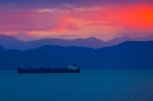 The transport ship at sunset in the Avacha Bay on the Kamchatka Peninsula