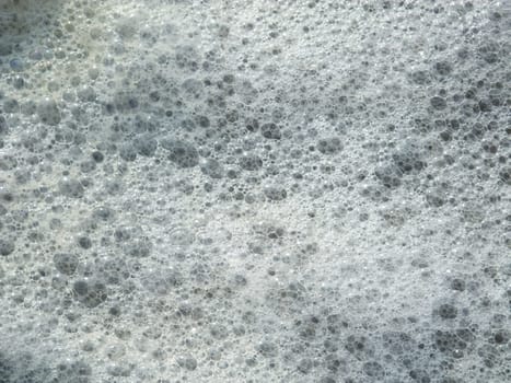 Foam made by the wave on the beach