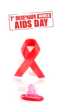 Aids ribbon and condom on white background.