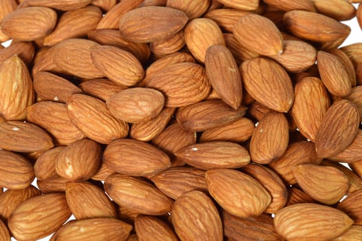 Tasty almonds nuts isolated on white background