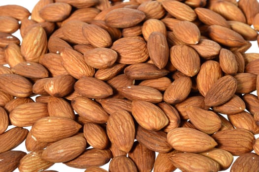 Tasty almonds nuts isolated on white background