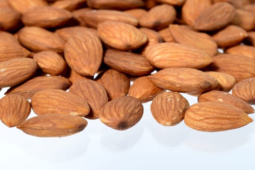 Tasty almonds nuts isolated on white background