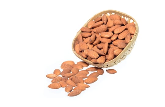 Almonds in a wooden basket with heap isolated on a white background