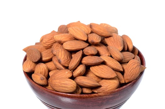 Almonds in a wooden bowl isolated on a white background