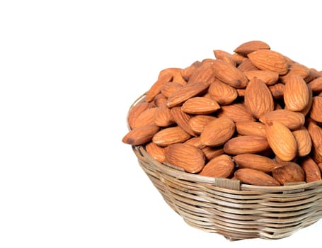 Almonds in a wooden basket with heap isolated on a white background