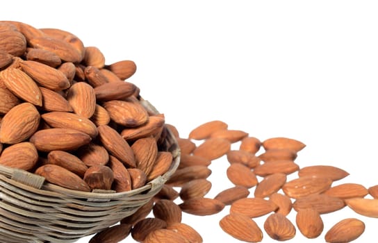 Almonds in a wooden basket with heap isolated on a white background