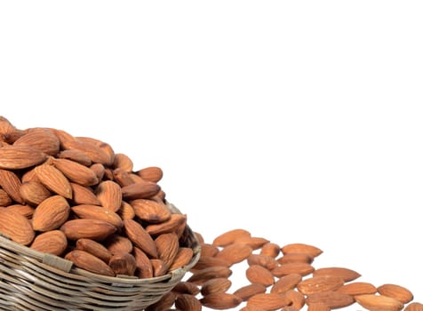 Almonds in a wooden basket with heap isolated on a white background