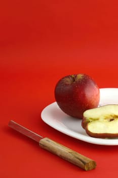Ripe Red Apples on red background