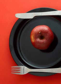 Ripe Red Apples on red background