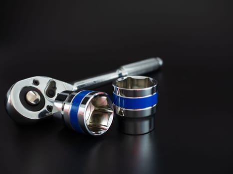 block wrench set and ratchet wrench on a black background.Block wrench set on a black background.