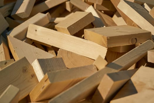Remains of building material made of wood on the storage yard for processing in a pellet plant in the north of the city of Magdeburg in Germany