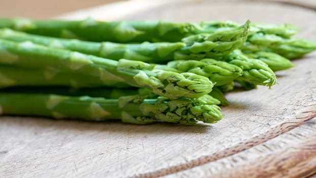 fresh green asparagus from an asparagus field as an ingredient in a kitchen