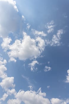 White and gray clouds with blue sky background.