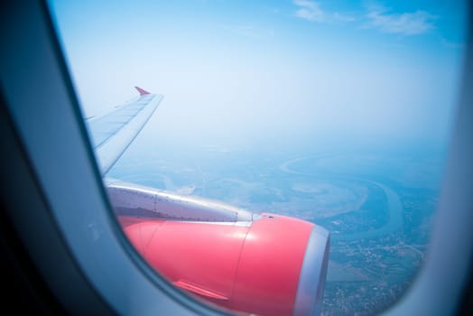 Sky view from airplane. Aerial view from windows. Transportation Concept.