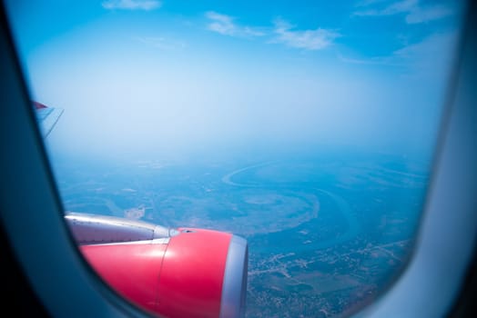 Sky view from airplane. Aerial view from windows. Transportation Concept.