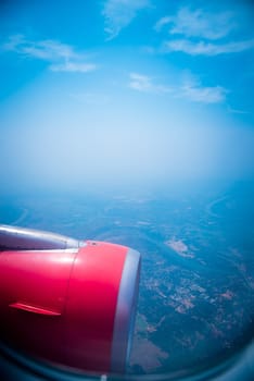 Sky view from airplane. Aerial view from windows. Transportation Concept.