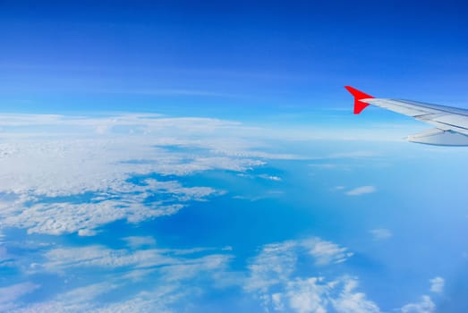Sky view from airplane. Aerial view from windows. Transportation Concept.