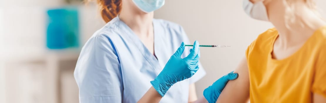 Nurse giving vaccine syringe against Covid 19 to patient. Concept immunization and vaccinating from pandemic of SARS.