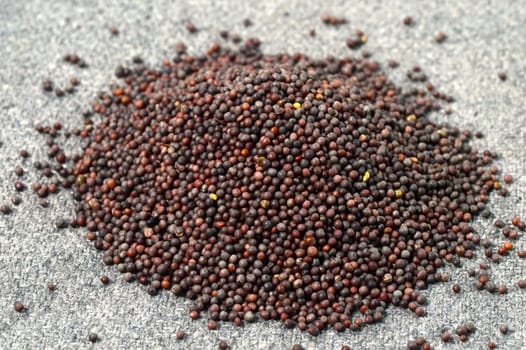 Heap Brown Mustard Seeds on sackcloth