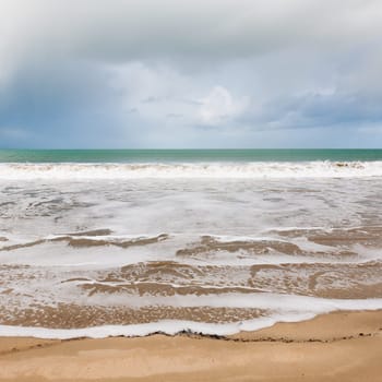 Soft wave of the sea on the sandy beach in Brittany, France