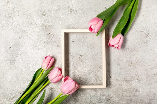 Creative banner with pink tulips flower. View with copy space. Women's Day Concept. Flat lay