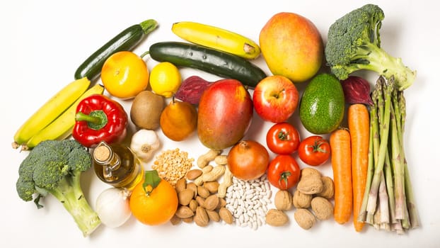 Healthy food clean eating selection: fruit, vegetable, seeds, superfood, cereals, leaf vegetable on white with copy space. Diet concept. Flat lay, top view