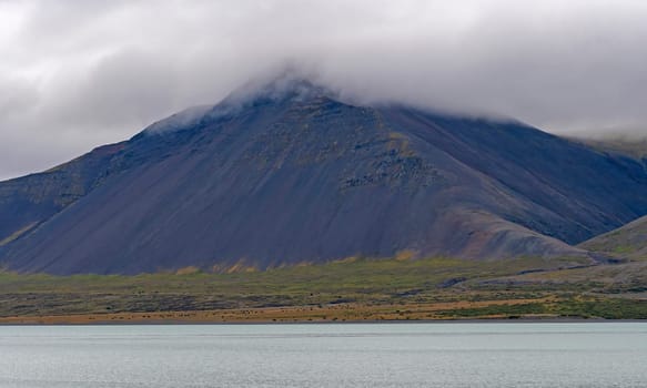 Distinctive Volcanic Landscape in Coastal Clouds near Borgarnes, Iceland