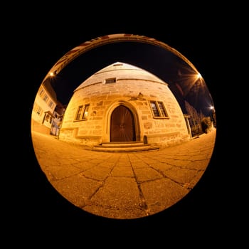 In front of a church with fish-eye-lens distortion