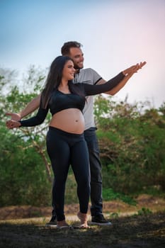 Photo of a young couple, the girl is pregnant
