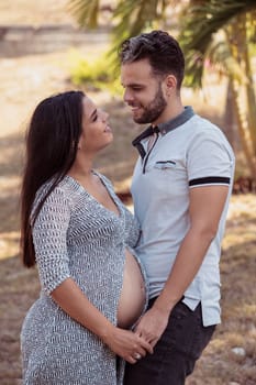 Photo of a young couple, the girl is pregnant