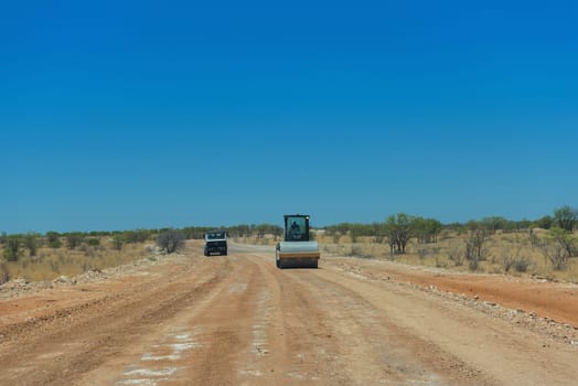 Repair work on an unpaved road in the Erongo Mountains, Namibia