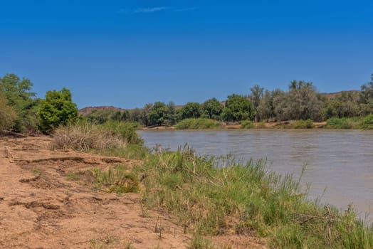 Landscape on the banks of the Kunene River, the border river between Namibia and Angola