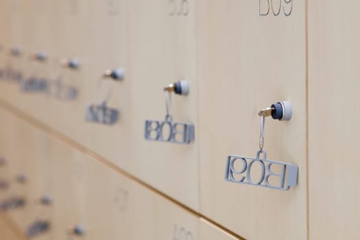 Modern clear wooden lockers. Selective focus
