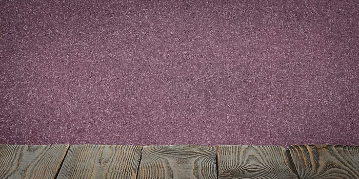 The background is blank wooden boards and a textured plastered wall with lighting and vignetting. For product demonstrations, free space, layout, mockup, perspective board, background board.