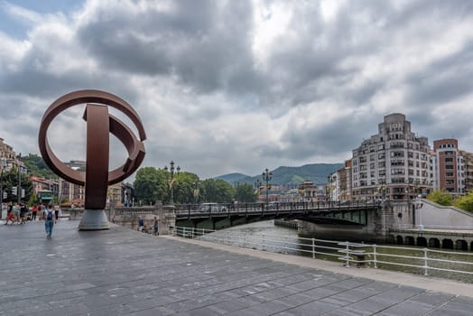 bilbao downtown with nervion river and boardwalk area, basque country, spain