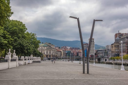 bilbao downtown with nervion river and boardwalk area, basque country, spain